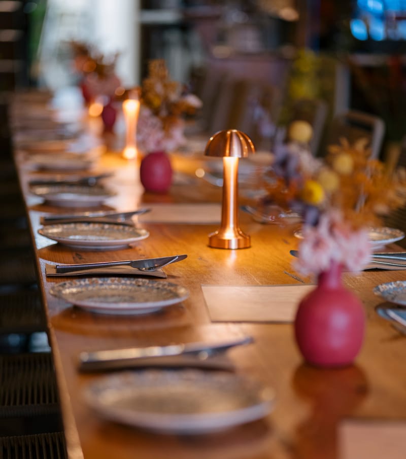 Table setting with copper lamp